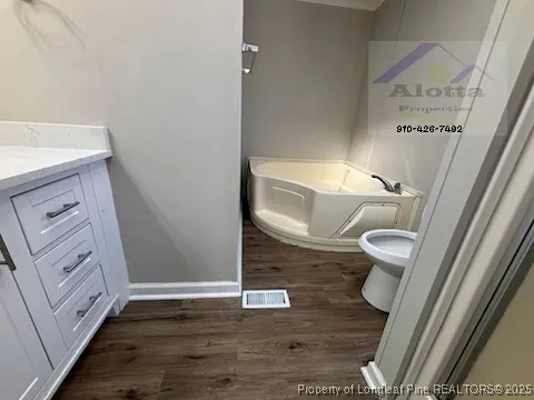 a bathroom with a toilet and a sink