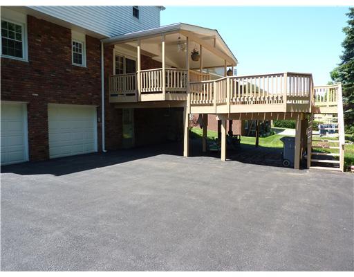 211 Lytton Road Coraopolis, PA 15108 - Photo 18 of 18 Exterior Back. TWO SEPARATE GARAGE DOORS WITH OPENERS AND ONE PARKING SPACE UNDER THE COVERED DECK.