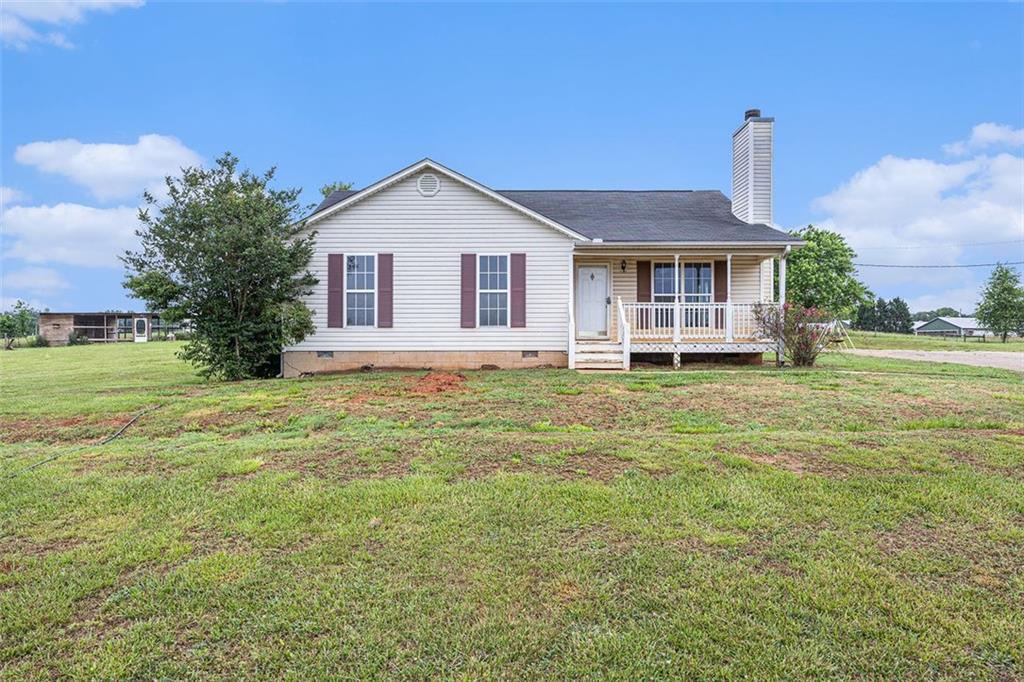 1190 Beck Road Hull, GA 30646 - Photo 1 of 1 a front view of a house with a yard