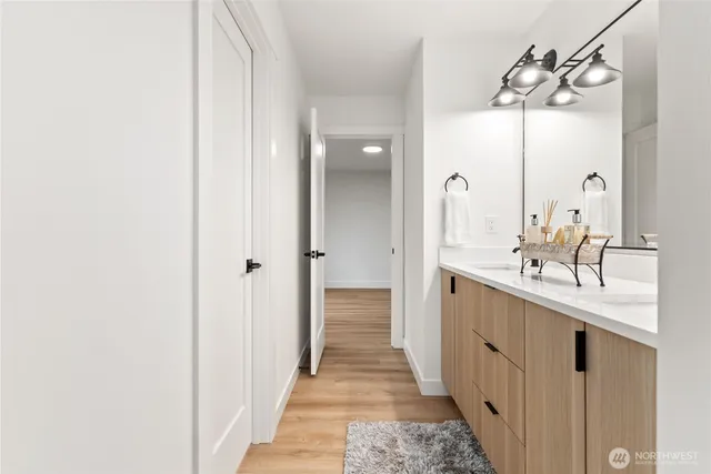 a spacious bedroom with a large bed and a large window