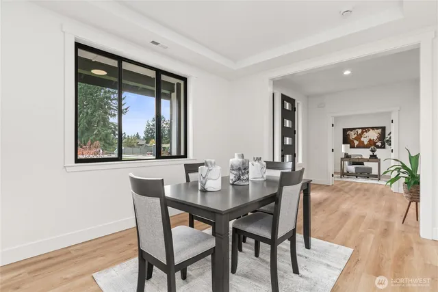 a dining room with furniture and window
