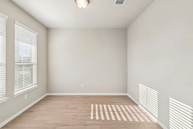 a view of kitchen with counter top space stainless steel appliances and cabinets