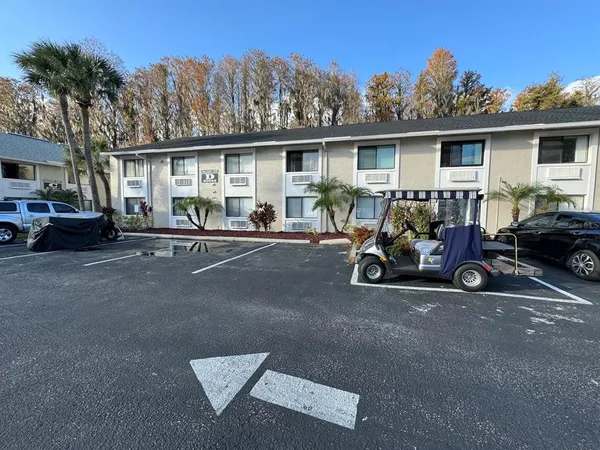 a view of a car park in front of house