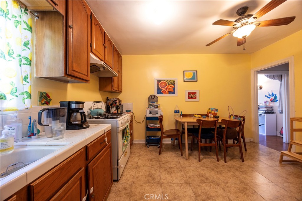 908 Summit Drive South Pasadena, CA 91030 - Photo 16 of 18 a kitchen with lots of chairs and appliances