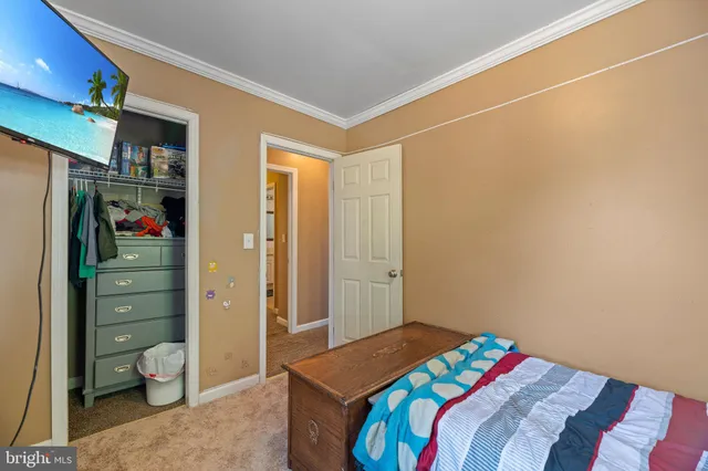 a bedroom with a bed and a cabinets