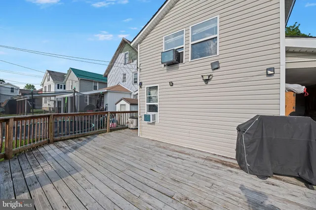 a view of a house with wooden deck