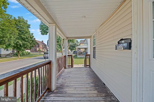 a view of a porch and wooden floor