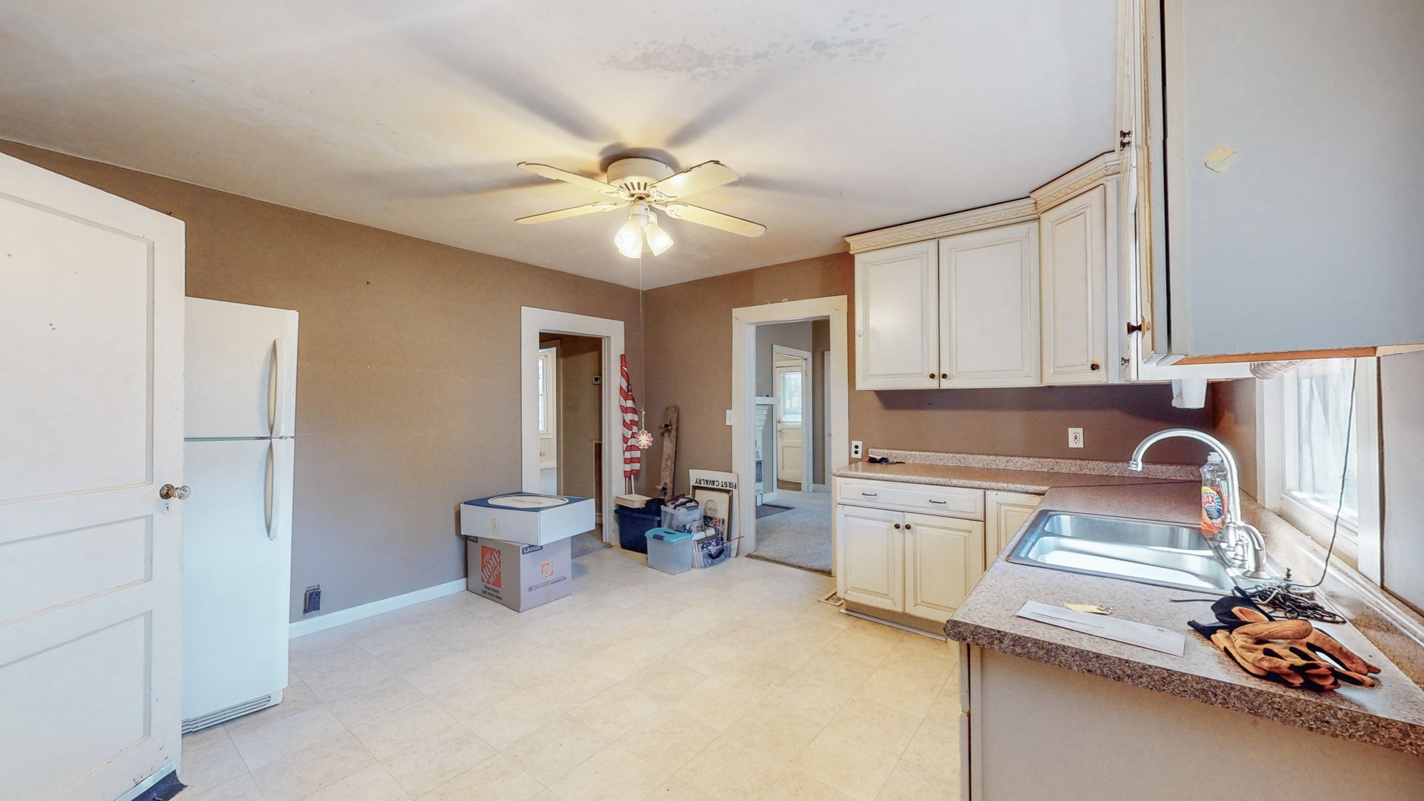 710 Canoe Branch Road Lebanon, TN 37087 - Photo 13 of 65 a kitchen with a refrigerator sink and white cabinets