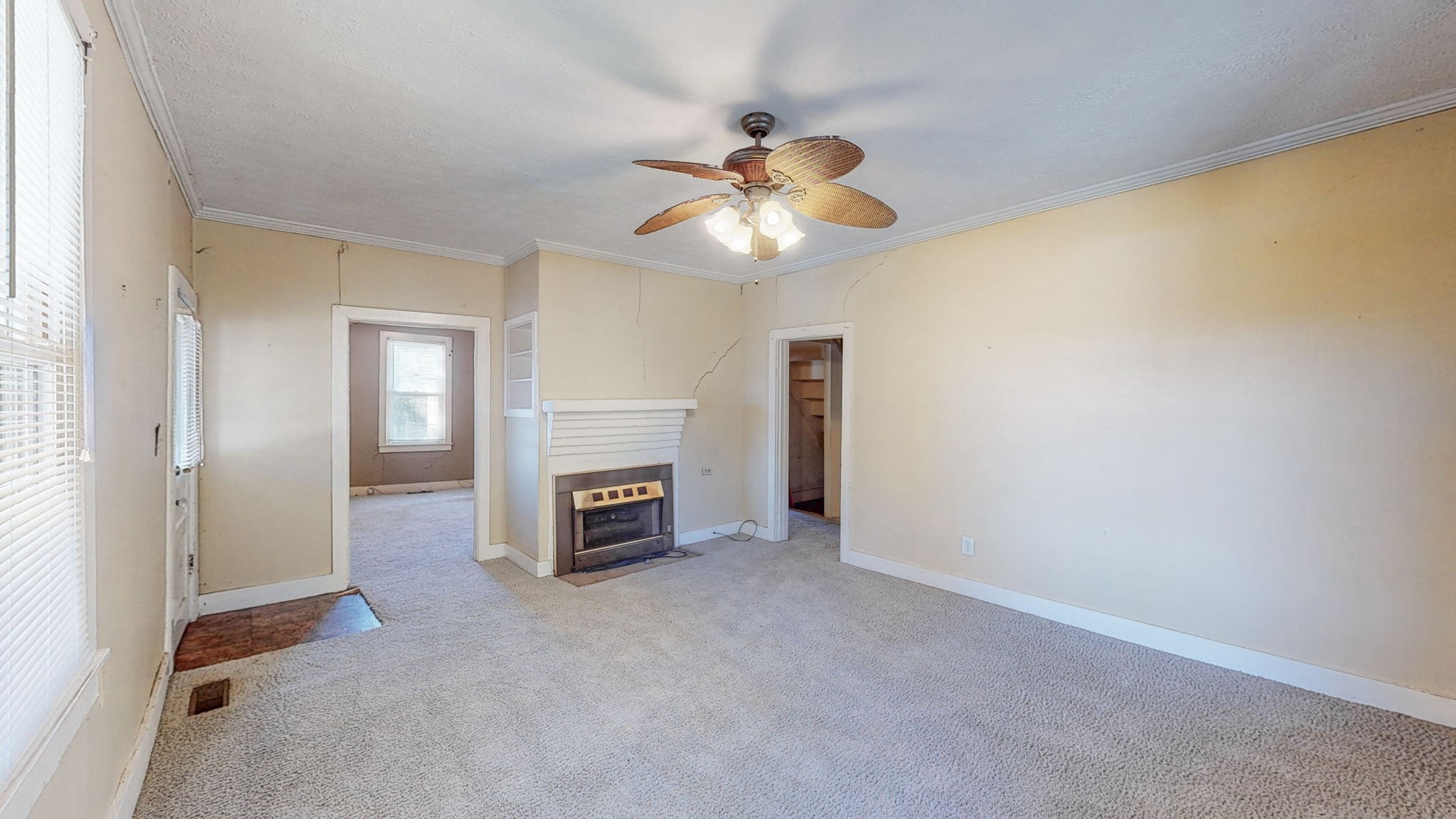 710 Canoe Branch Road Lebanon, TN 37087 - Photo 2 of 65 wooden floor in an empty room with a fireplace