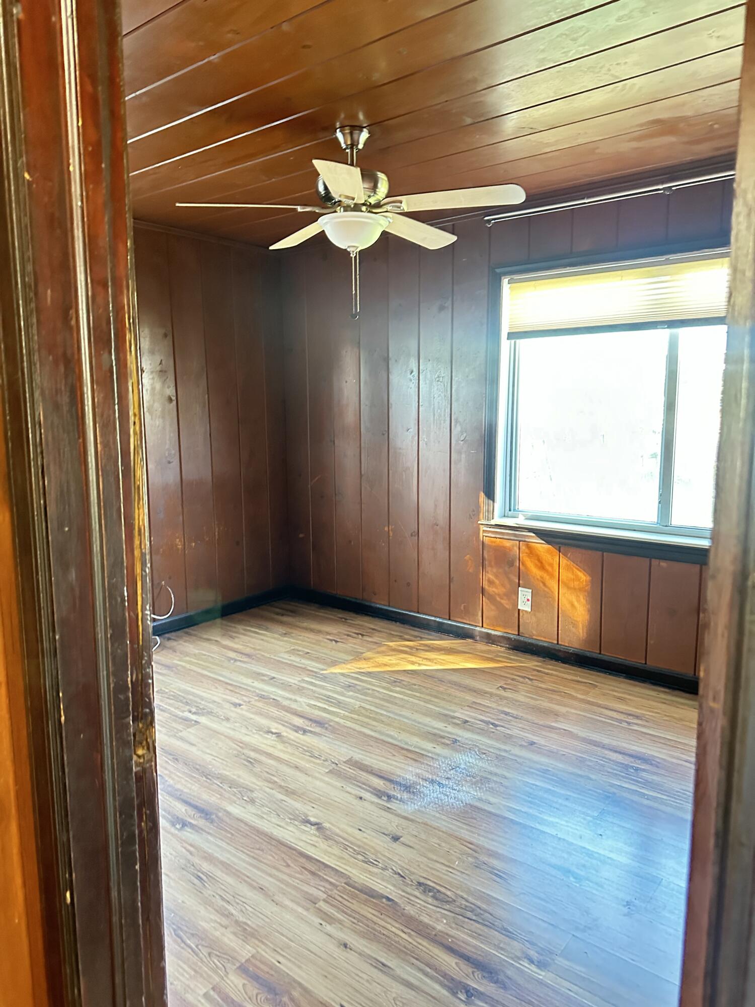 225 Northeast 13th Street Delray Beach, FL 33444 - Photo 11 of 23 a view of an empty room with wooden floor and a window