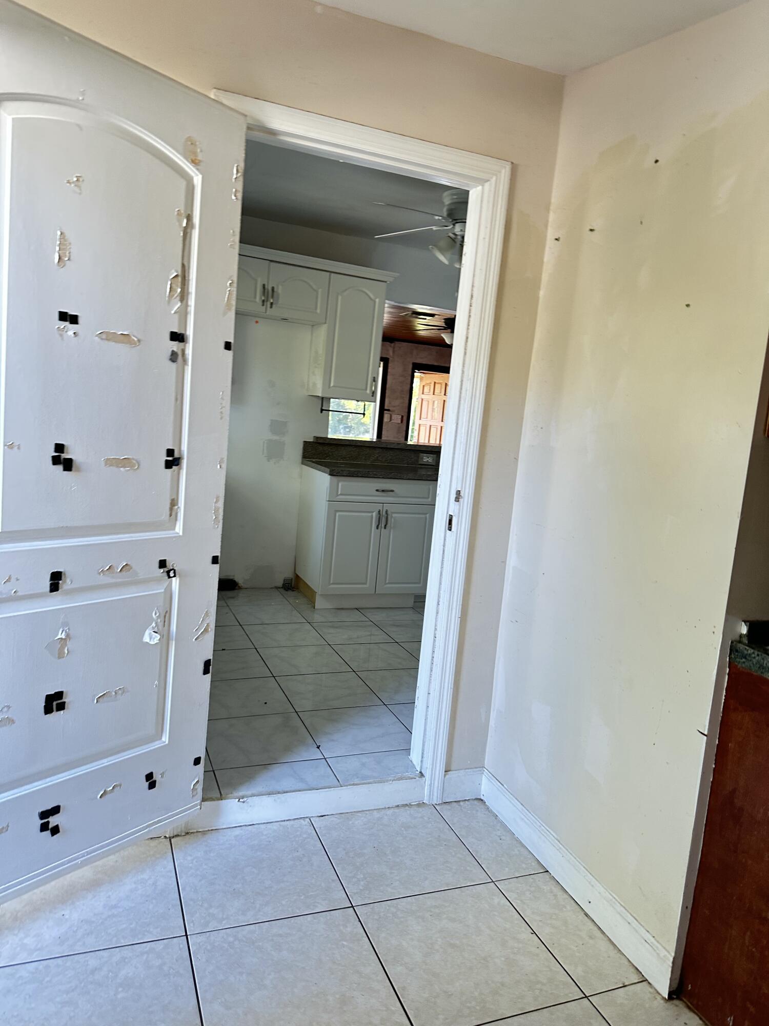 225 Northeast 13th Street Delray Beach, FL 33444 - Photo 15 of 23 a view of kitchen with baby crib