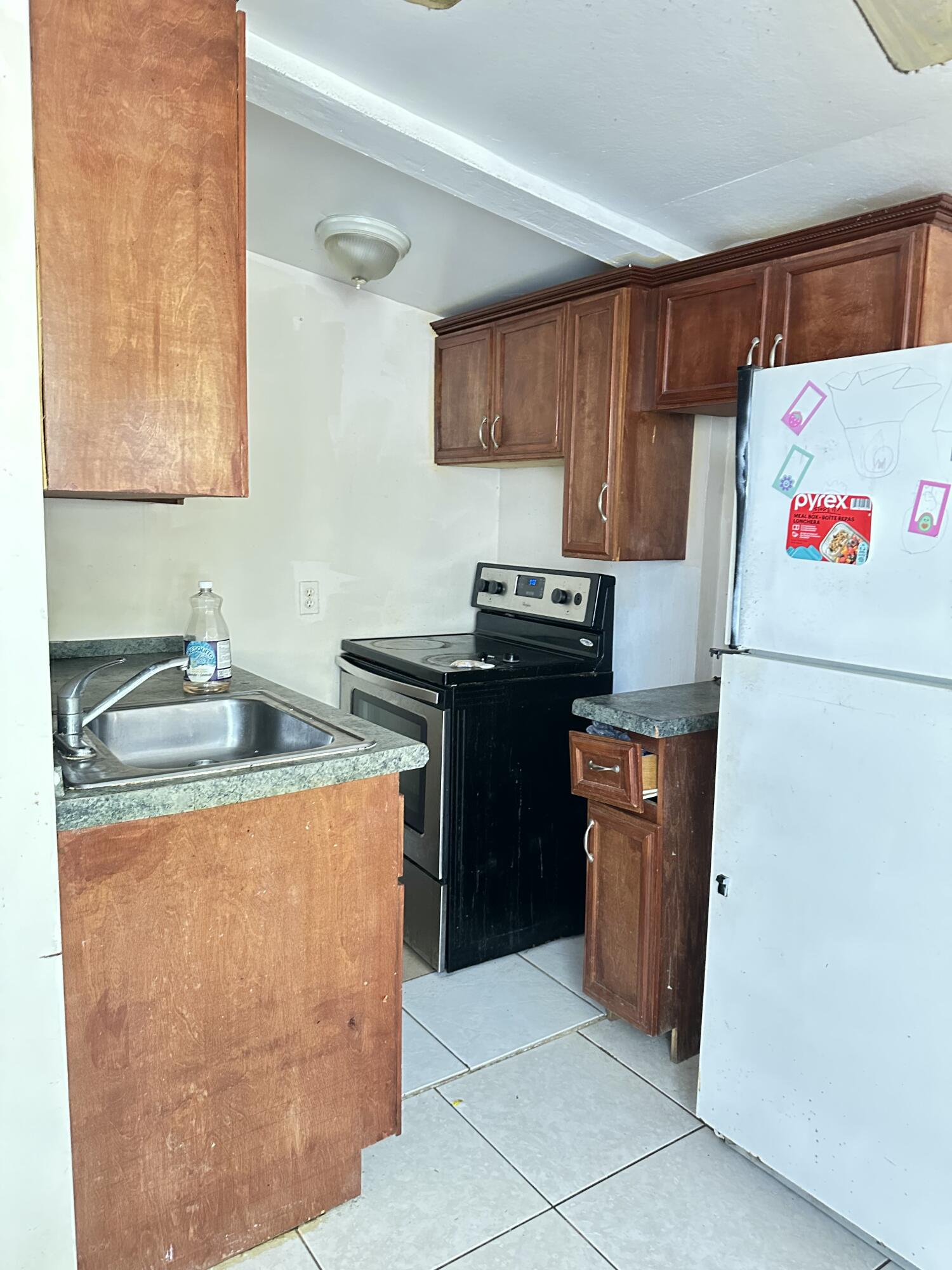 225 Northeast 13th Street Delray Beach, FL 33444 - Photo 16 of 23 a kitchen with stainless steel appliances granite countertop a refrigerator stove a sink and dishwasher