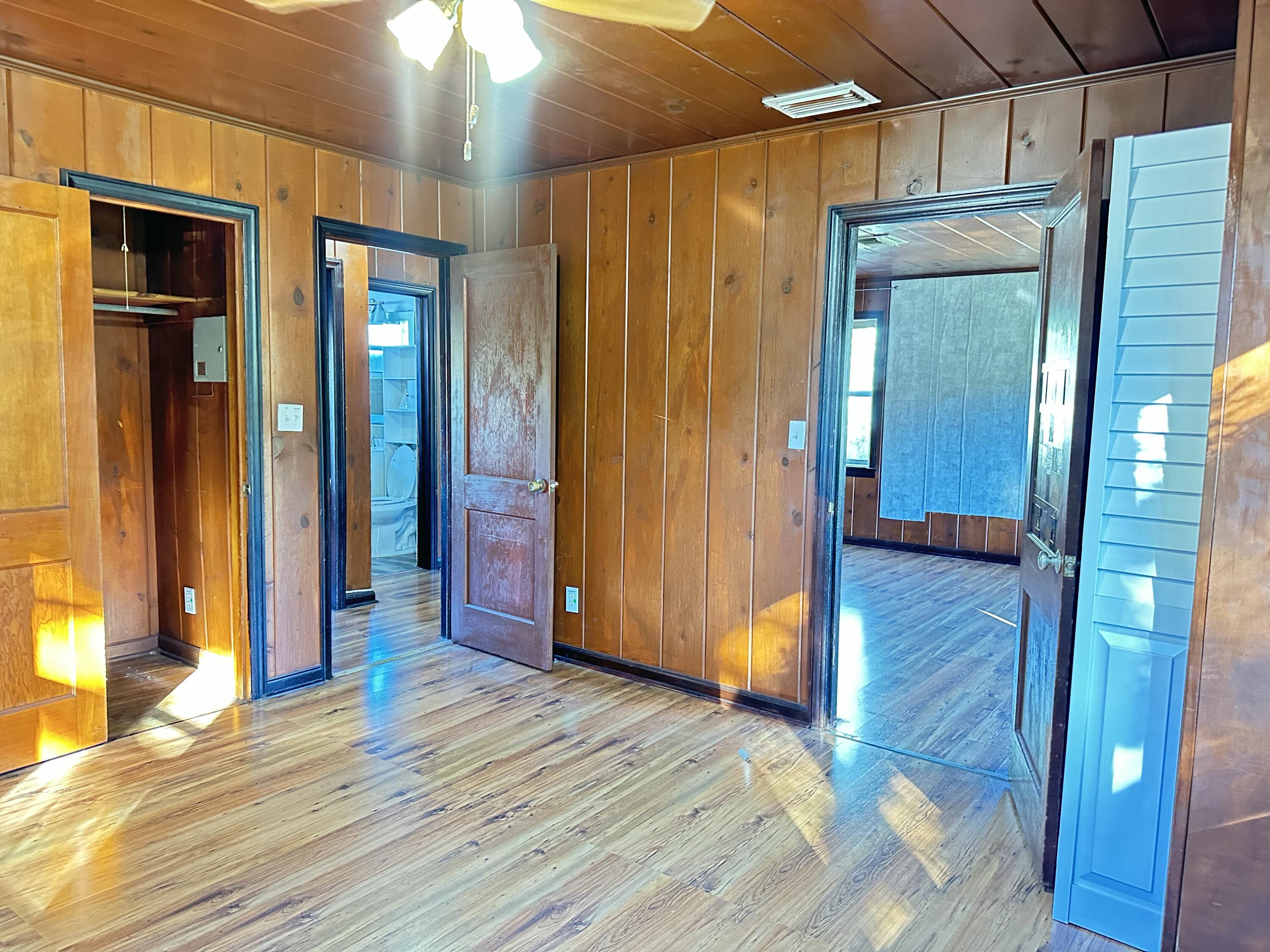 225 Northeast 13th Street Delray Beach, FL 33444 - Photo 21 of 23 a view of a hallway with wooden floor