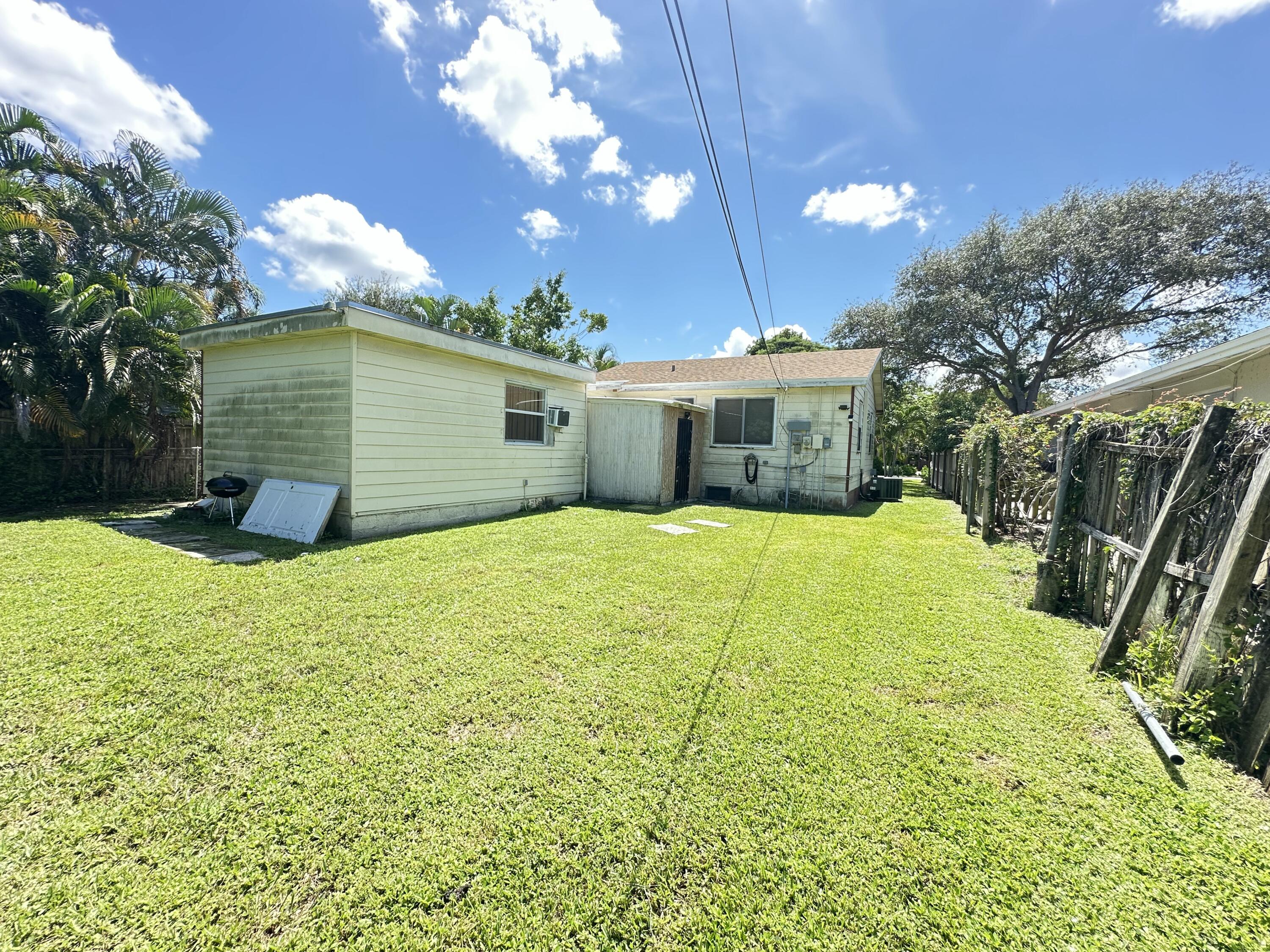 225 Northeast 13th Street Delray Beach, FL 33444 - Photo 4 of 23 a view of a house with a yard