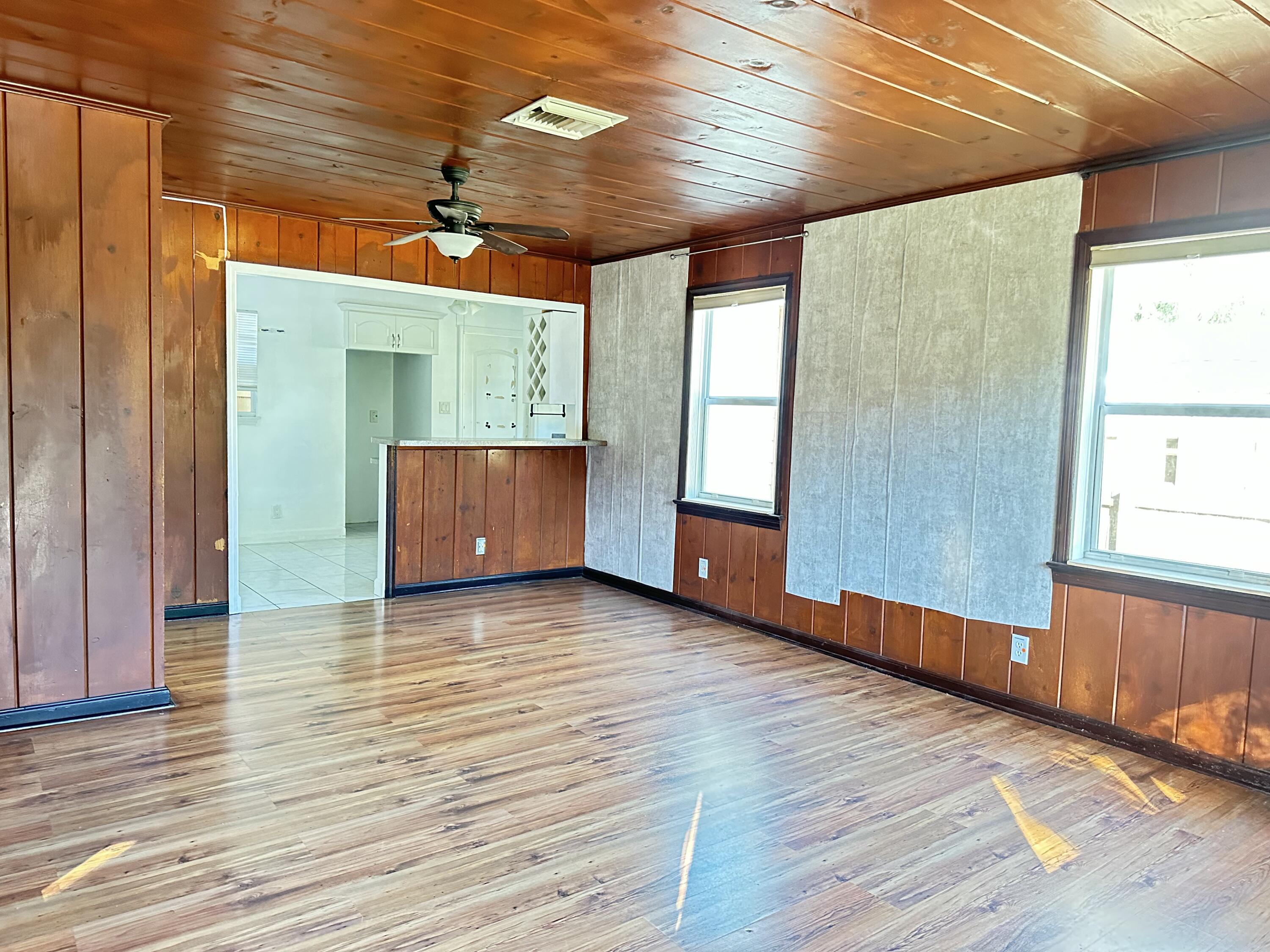 225 Northeast 13th Street Delray Beach, FL 33444 - Photo 6 of 23 a view of room with window and wooden floor