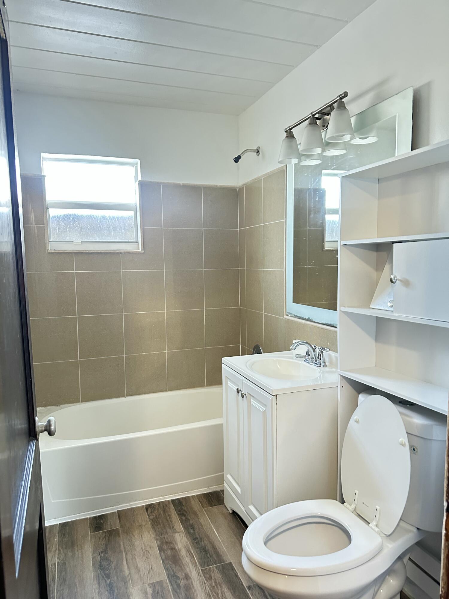 225 Northeast 13th Street Delray Beach, FL 33444 - Photo 10 of 23 a bathroom with a sink a toilet and shower