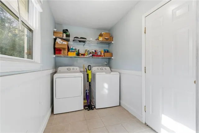a utility room with dryer and washer