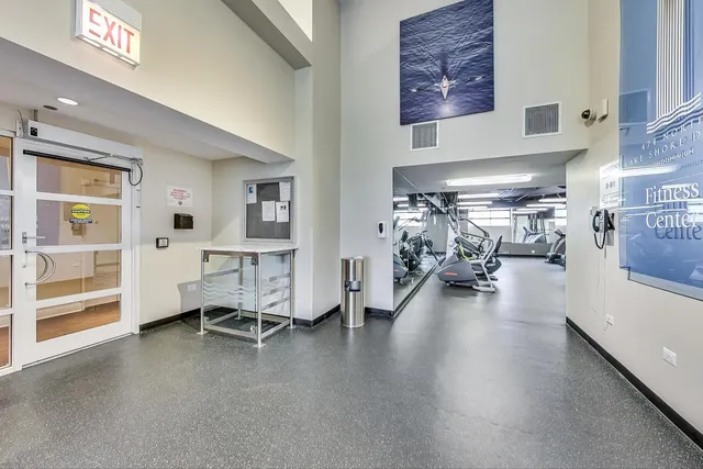 a view of a livingroom with furniture and a large window