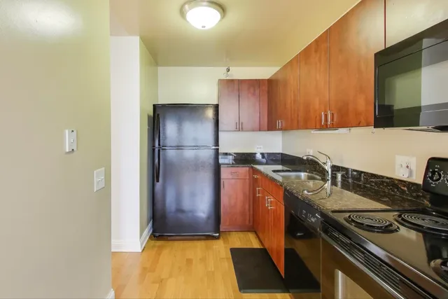 a kitchen with a stove and a refrigerator