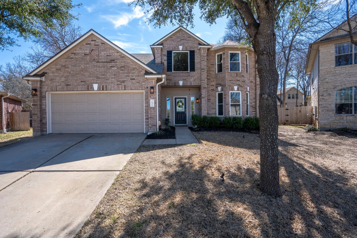 160 Pilot Grove Court Buda, TX 78610 - Photo 1 of 1 a front view of a house with garden