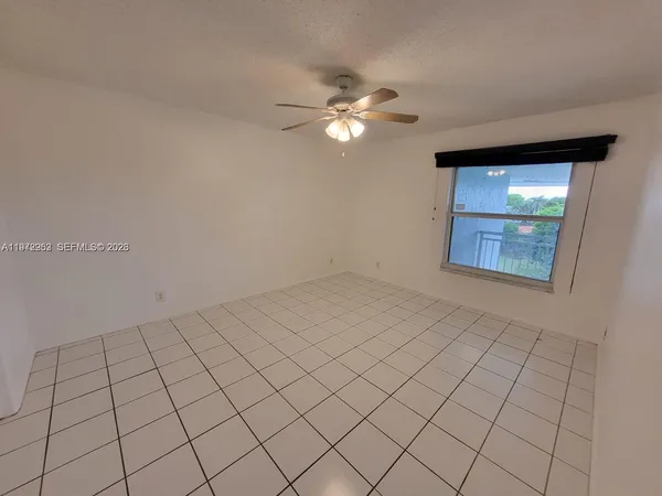 a view of an empty room and window