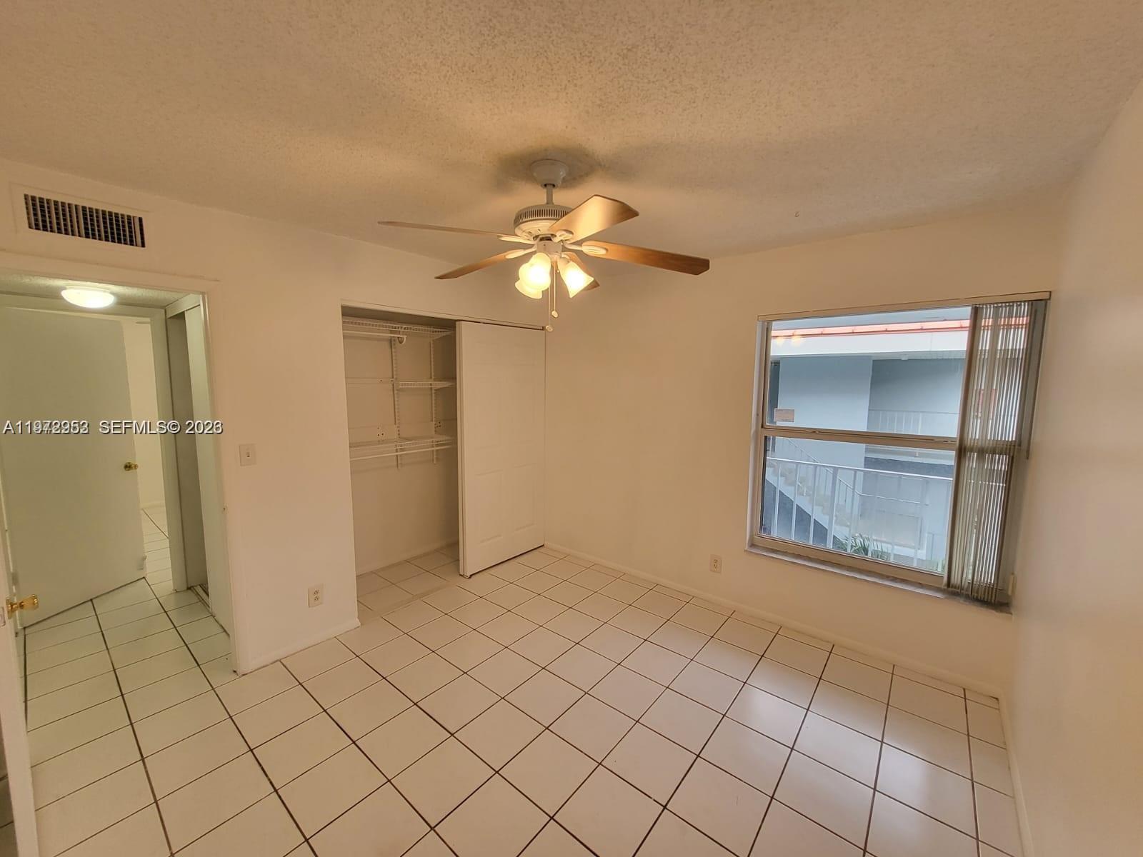 455 South Pine Island Road, Unit 410C Plantation, FL 33324 - Photo 16 of 35 wooden floor in an empty room with a bathroom