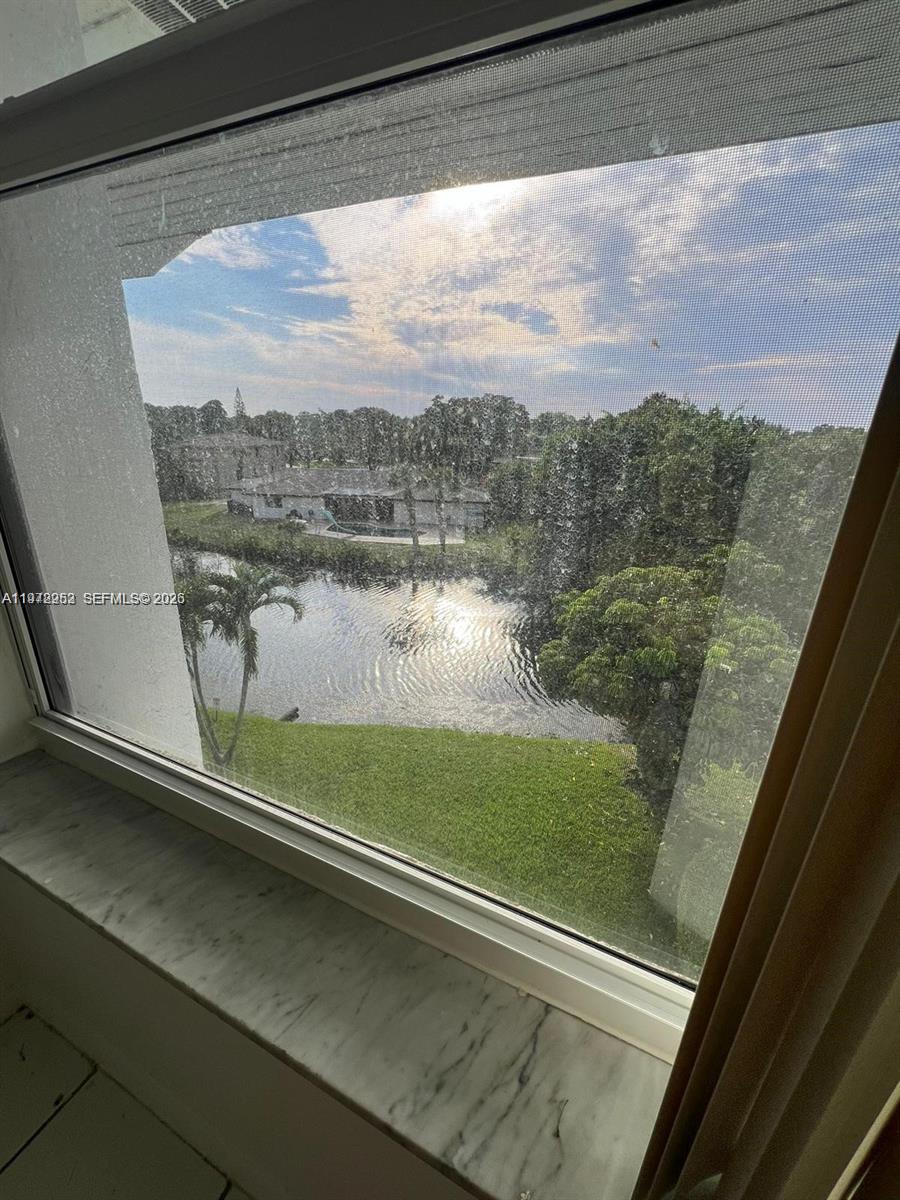 455 South Pine Island Road, Unit 410C Plantation, FL 33324 - Photo 19 of 35 a view of a lake from a window