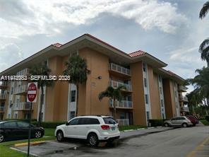 455 South Pine Island Road, Unit 410C Plantation, FL 33324 - Photo 2 of 35 a car parked in front of a house