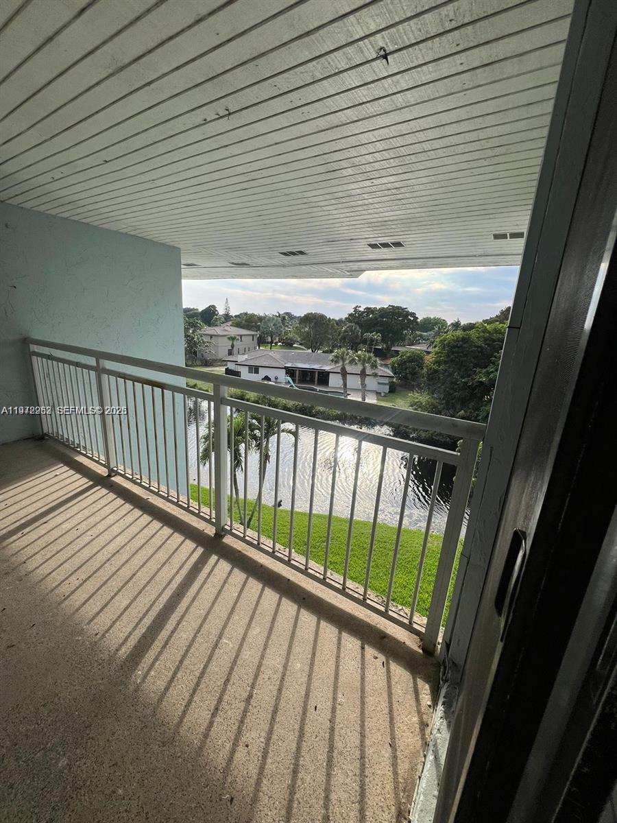 455 South Pine Island Road, Unit 410C Plantation, FL 33324 - Photo 21 of 35 a view of balcony with wooden floor