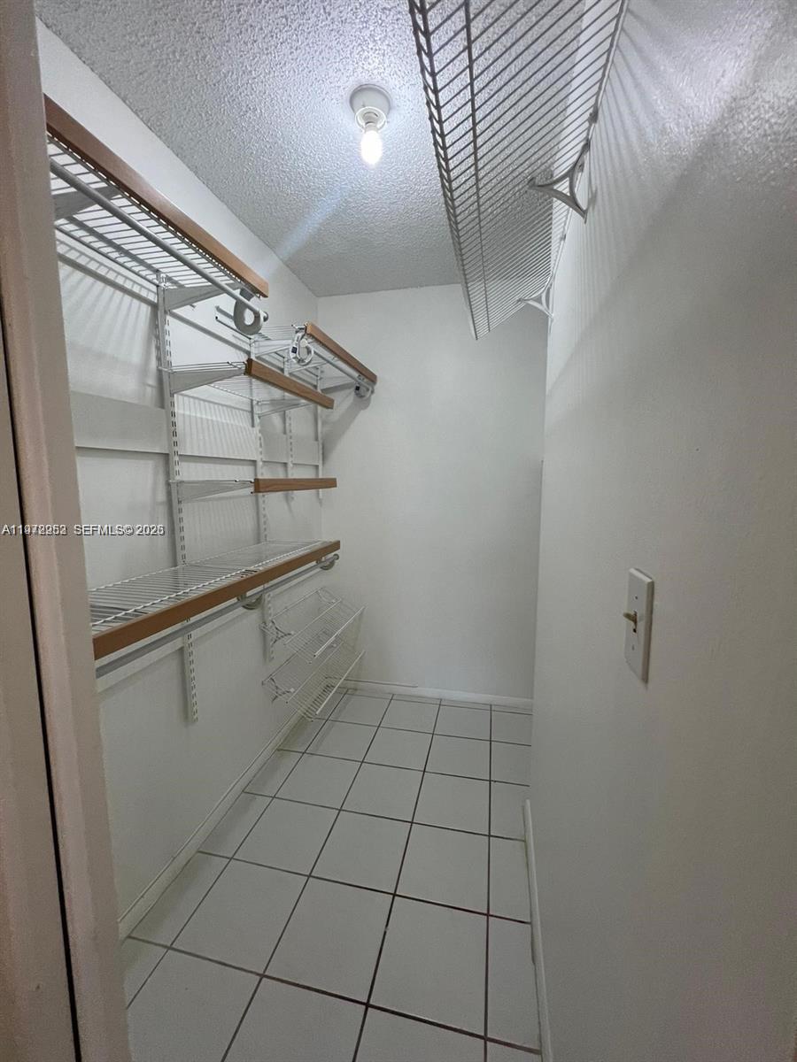 455 South Pine Island Road, Unit 410C Plantation, FL 33324 - Photo 24 of 35 a view of an empty walk in closet