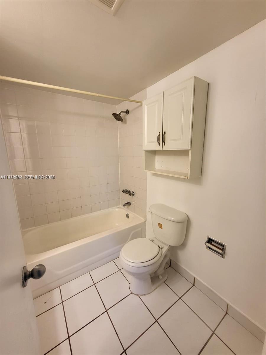 455 South Pine Island Road, Unit 410C Plantation, FL 33324 - Photo 25 of 35 a bathroom with a granite countertop sink a toilet and bathtub