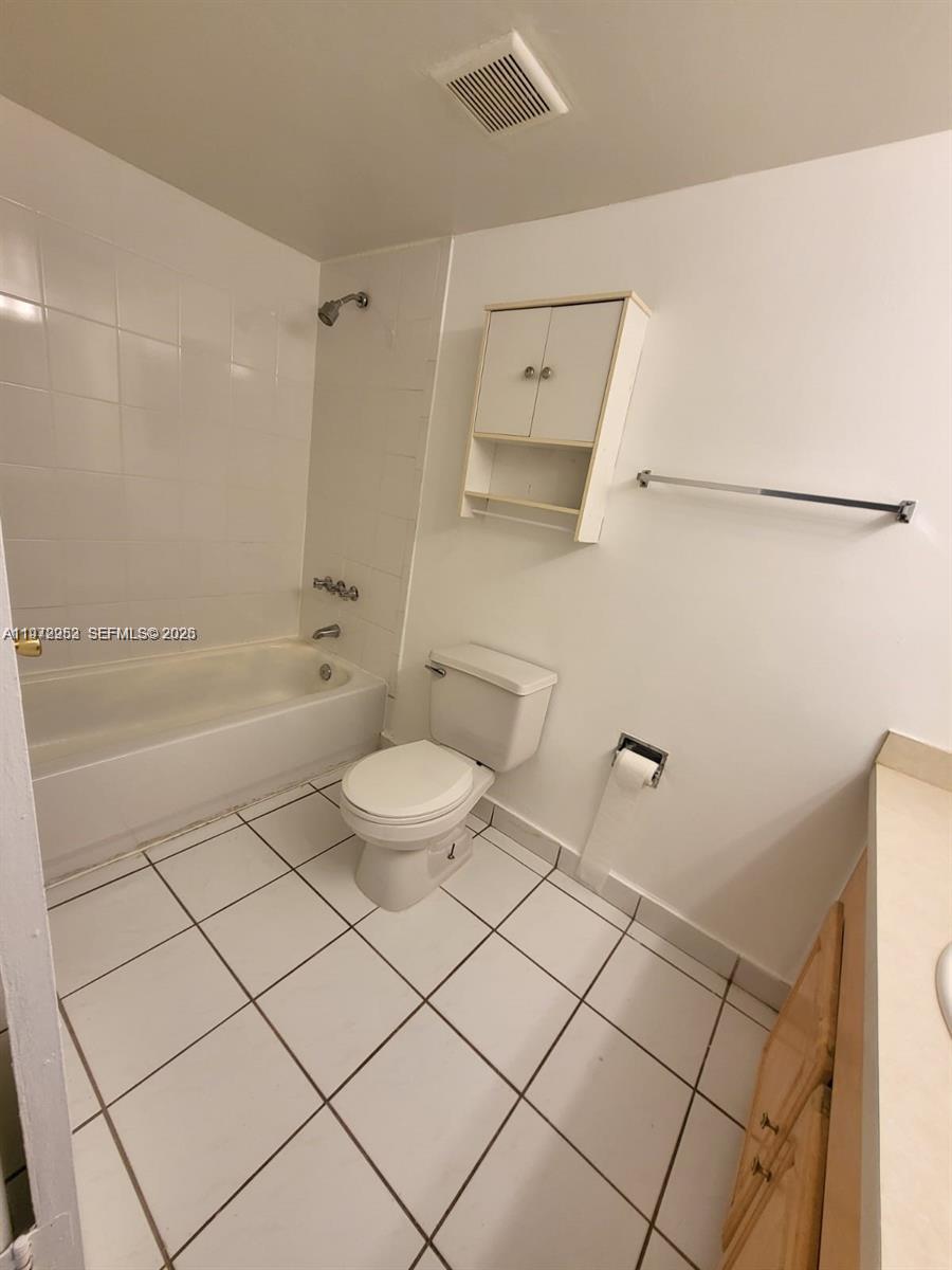 455 South Pine Island Road, Unit 410C Plantation, FL 33324 - Photo 26 of 35 a bathroom with a toilet and a shower