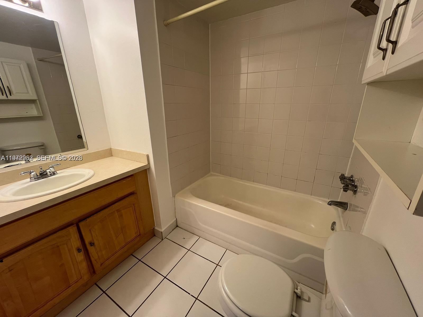 455 South Pine Island Road, Unit 410C Plantation, FL 33324 - Photo 27 of 35 a bathroom with a sink a toilet and bathtub