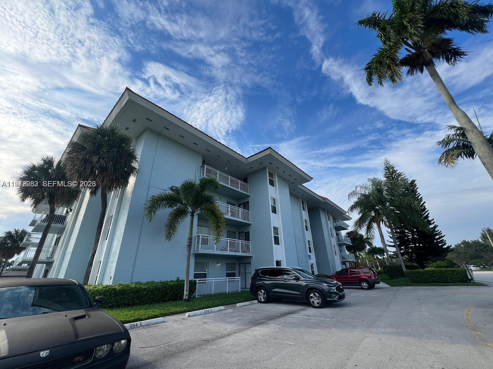 455 South Pine Island Road, Unit 410C Plantation, FL 33324 - Photo 32 of 35 a car parked in front of a house