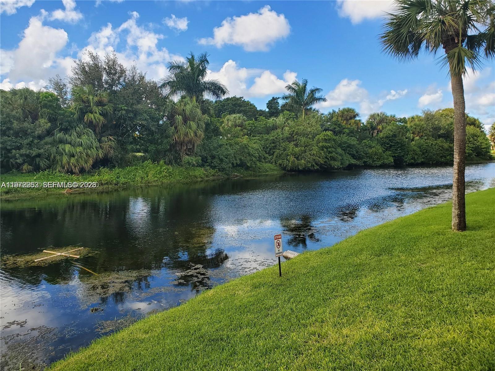 455 South Pine Island Road, Unit 410C Plantation, FL 33324 - Photo 33 of 35 a lake view with a lake view
