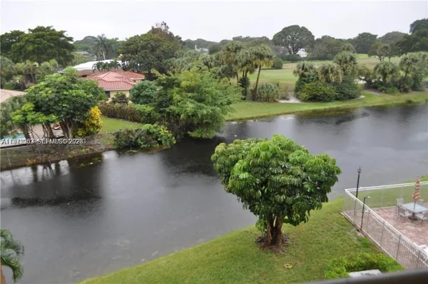 a view of swimming pool with a yard and sitting space