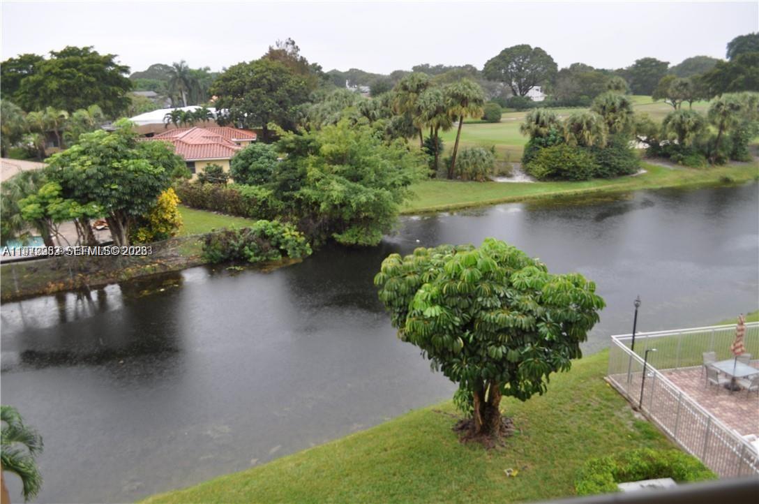455 South Pine Island Road, Unit 410C Plantation, FL 33324 - Photo 34 of 35 an aerial view of residential houses with outdoor space and lake view