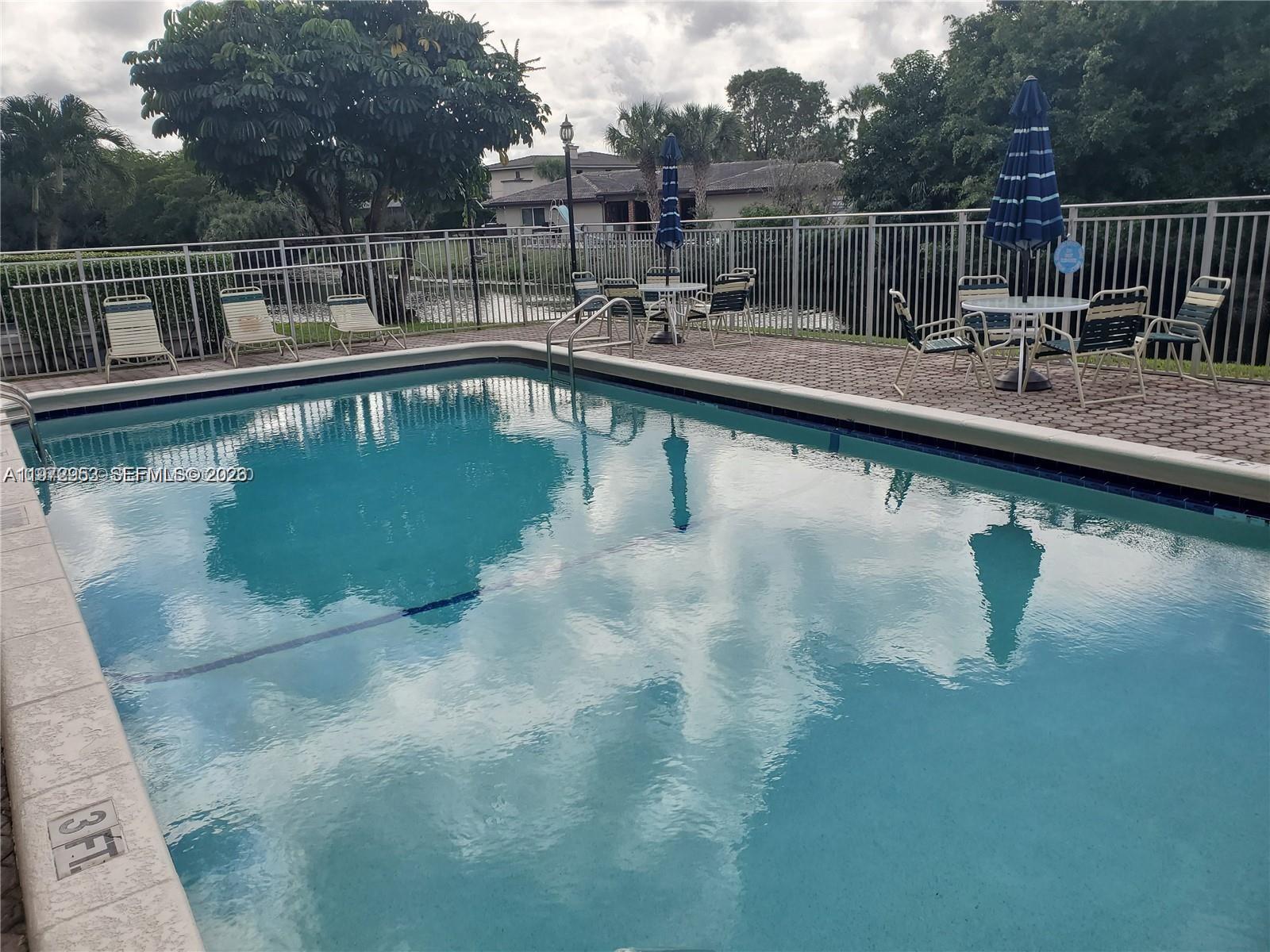 455 South Pine Island Road, Unit 410C Plantation, FL 33324 - Photo 35 of 35 a view of swimming pool with a yard and sitting space