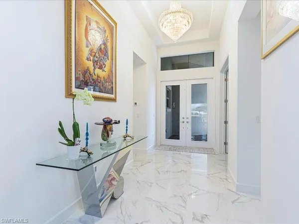 a view of a hallway with paintings on the wall