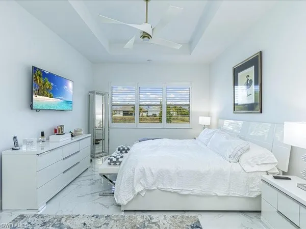 a bedroom with a bed and a desk