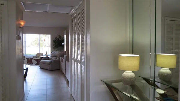 a view of living room with furniture and wooden floor