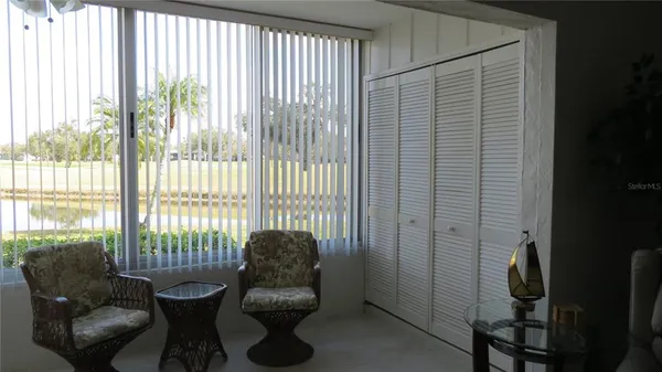 a living room with furniture and a window