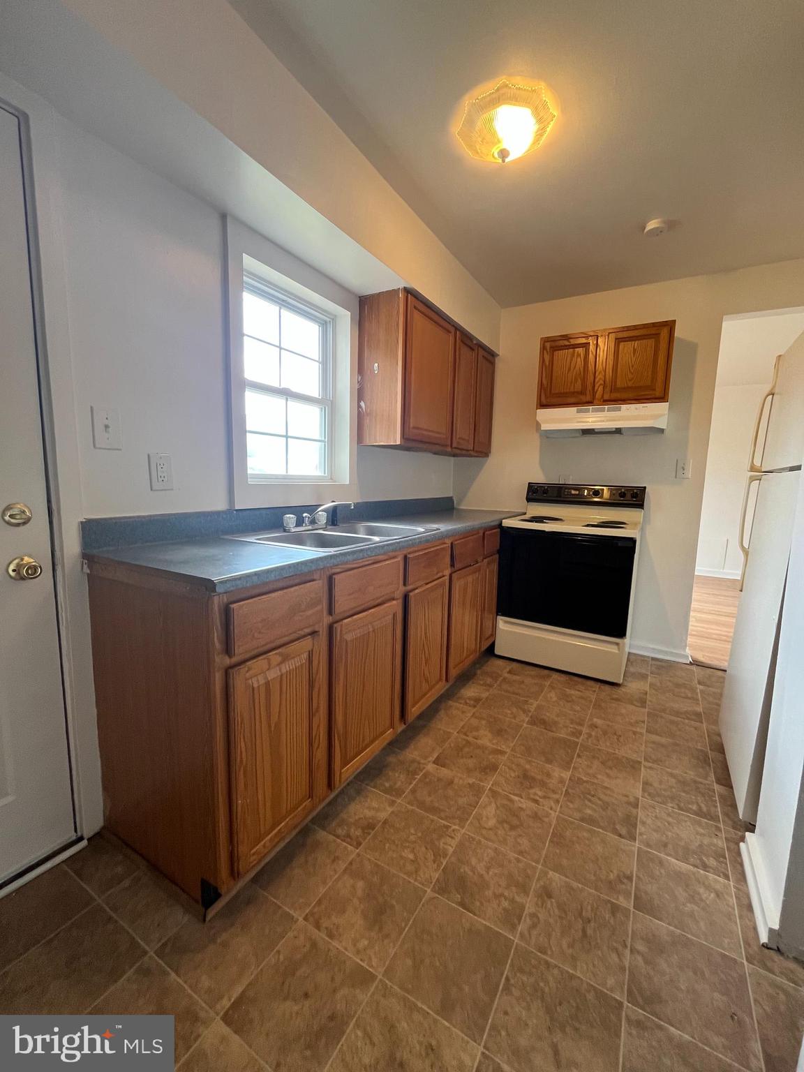 414 North High Street Martinsburg, WV 25404 - Photo 3 of 23 a kitchen with stainless steel appliances granite countertop a sink stove and refrigerator