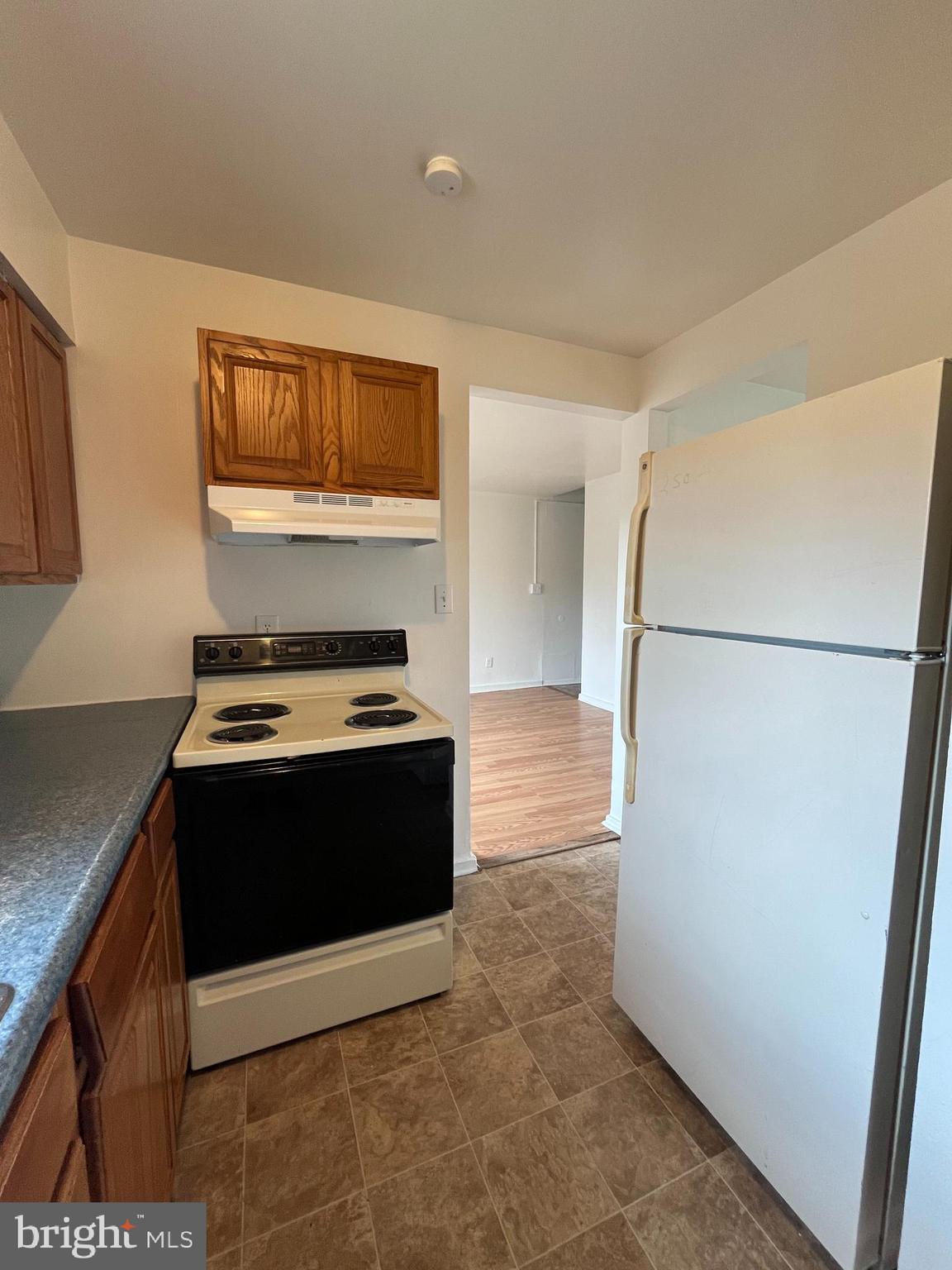 414 North High Street Martinsburg, WV 25404 - Photo 4 of 23 a kitchen with stainless steel appliances granite countertop a stove a refrigerator and a cabinets