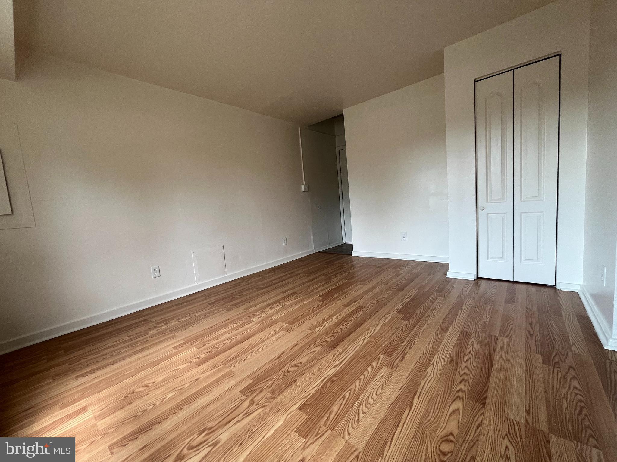 414 North High Street Martinsburg, WV 25404 - Photo 10 of 23 a view of a room with wooden floor and bench