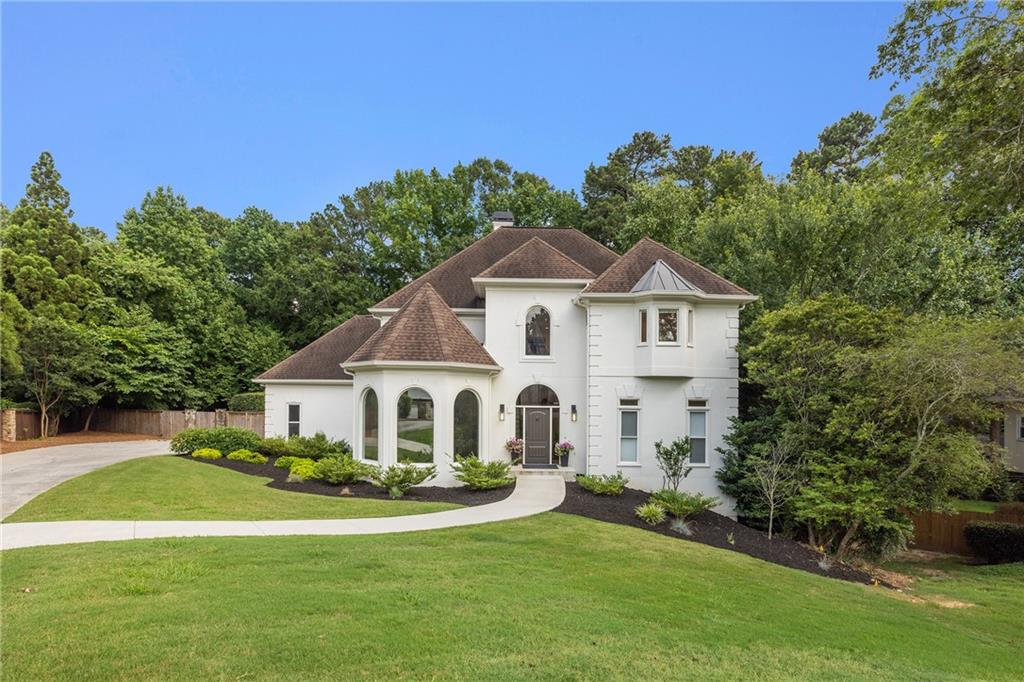 510 Northland Ridge Court Sandy Springs, GA 30342 - Photo 1 of 1 a view of a white house with a big yard and potted plants and a big yard