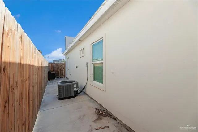 a view of storage and utility room with windows