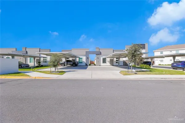 a view of a swimming pool with an outdoor seating and a yard