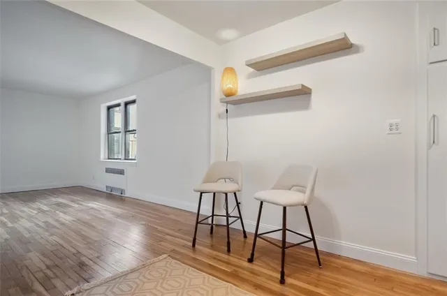 a view of a room that has a table and chair in it