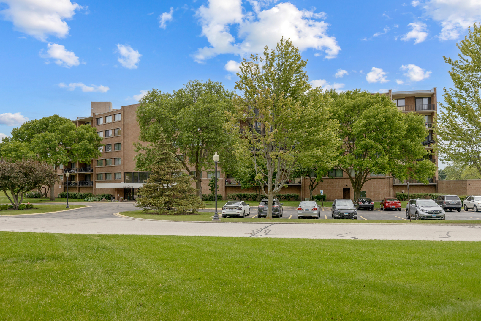 15 Bar Harbour Road, Unit 4F Schaumburg, IL 60193 - Photo 1 of 25 a view of outdoor space with garden and lots of trees